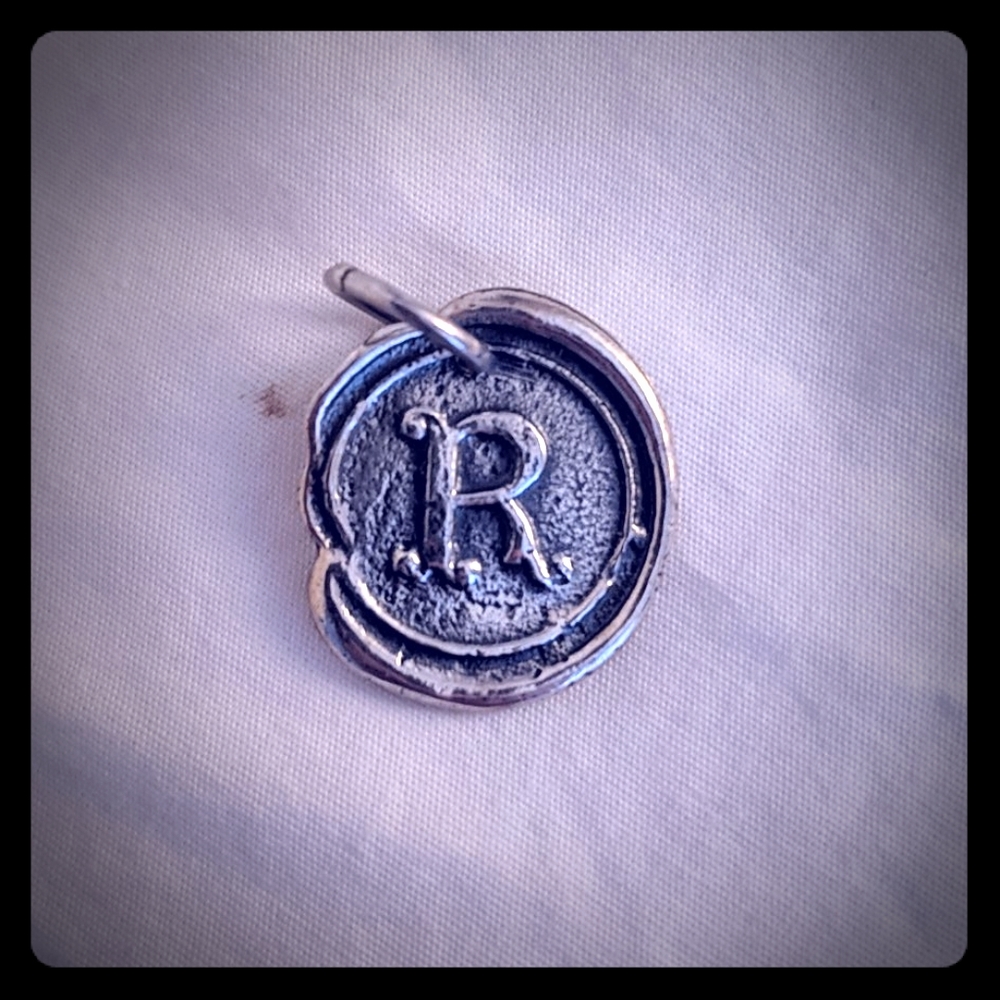 Waxing Poetic sterling silver R insignia pendant
